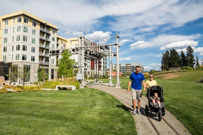 A family walks on the Eastside corridor